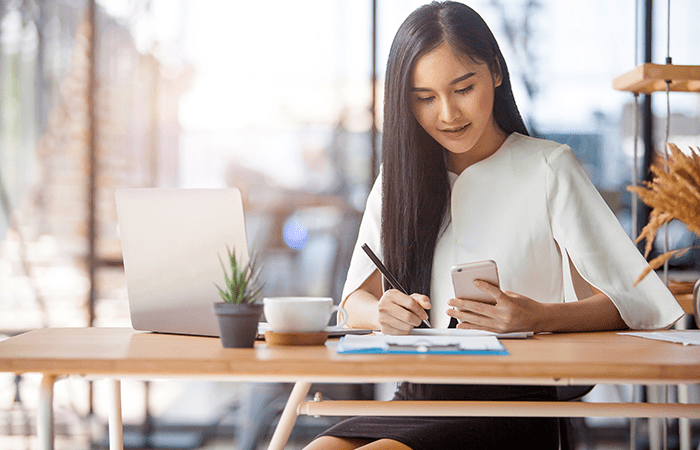 Woman Signing Document Image